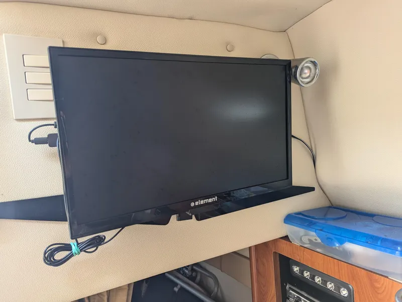 Slide: The Image of Flat-screen TV in 2004 Larson Cabrio 260 boat interior. - 21