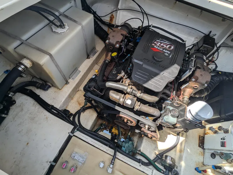 Slide: The Image of Engine compartment of a 2004 Larson Cabrio 260 boat with MerCruiser 350 engine. - 27
