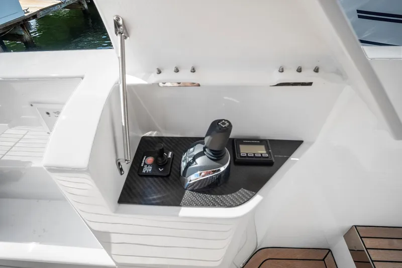 Slide: The Image of 2023 Astondoa AS5 yacht control panel with joystick and display. - 14
