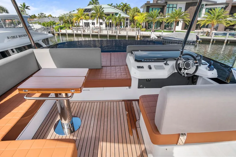 Slide: The Image of Luxurious 2023 Astondoa AS5 yacht interior with elegant seating and modern helm. - 16