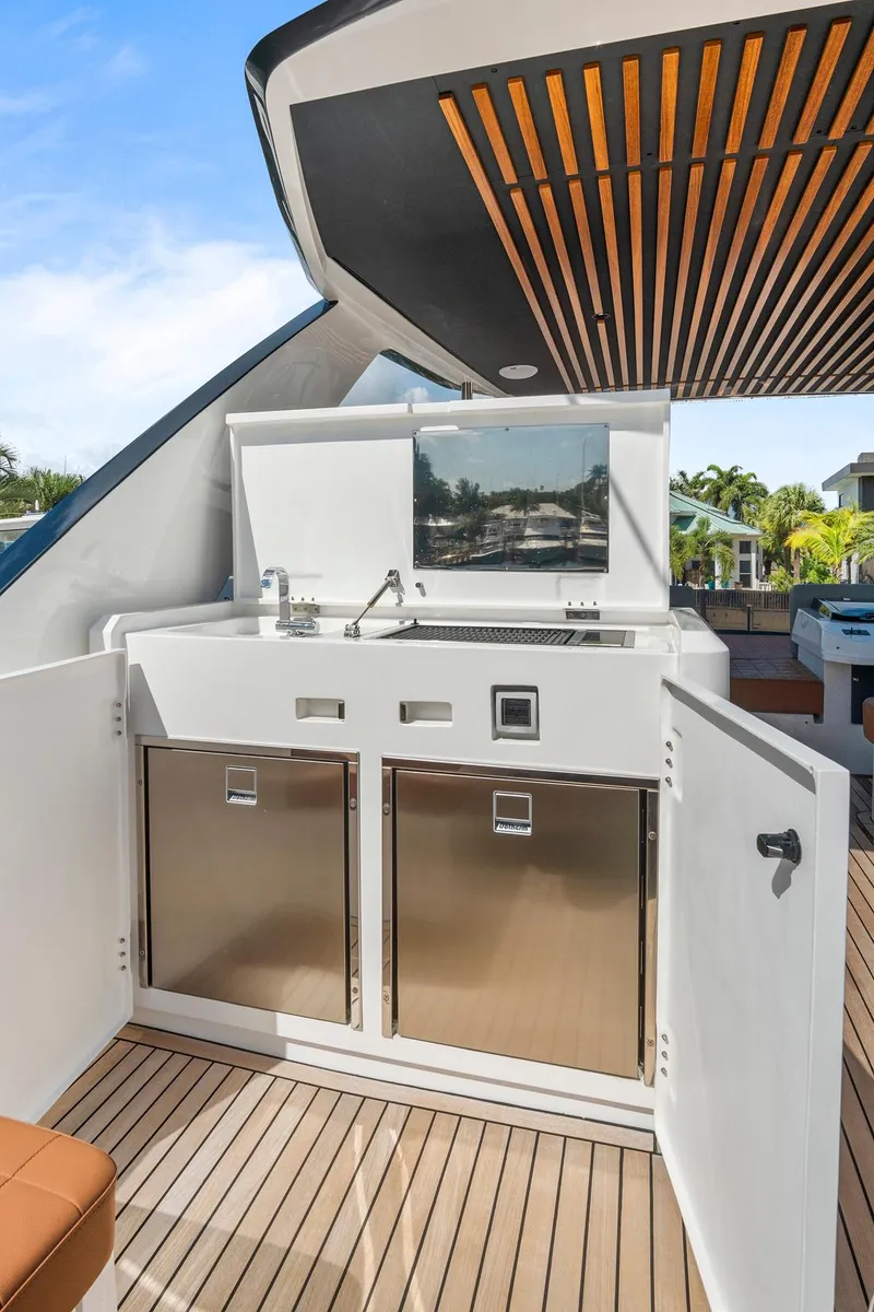 Slide: The Image of 2023 Astondoa AS5 yacht outdoor kitchen with sleek design and stainless steel appliances. - 21