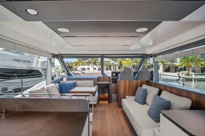 Slide: The Image of Luxurious 2023 Astondoa AS5 yacht interior with modern seating and panoramic windows. - 24