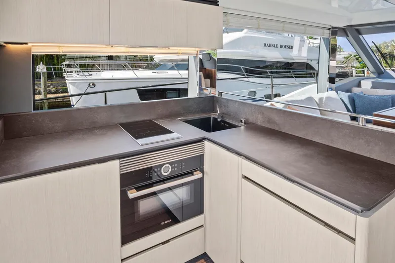 Slide: The Image of Modern kitchen in 2023 Astondoa AS5 yacht with sleek countertops and appliances. - 30