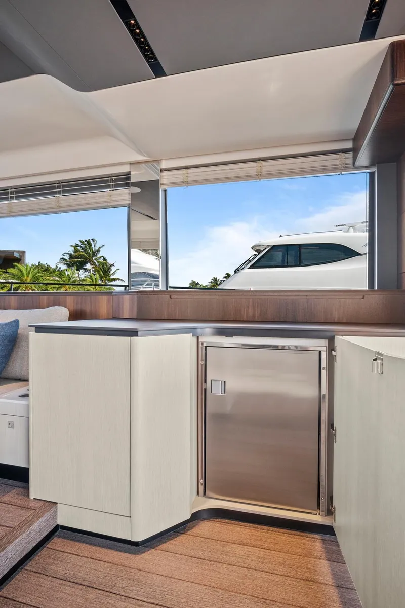 Slide: The Image of Luxurious interior of 2023 Astondoa AS5 yacht with modern cabinetry and scenic window view. - 31