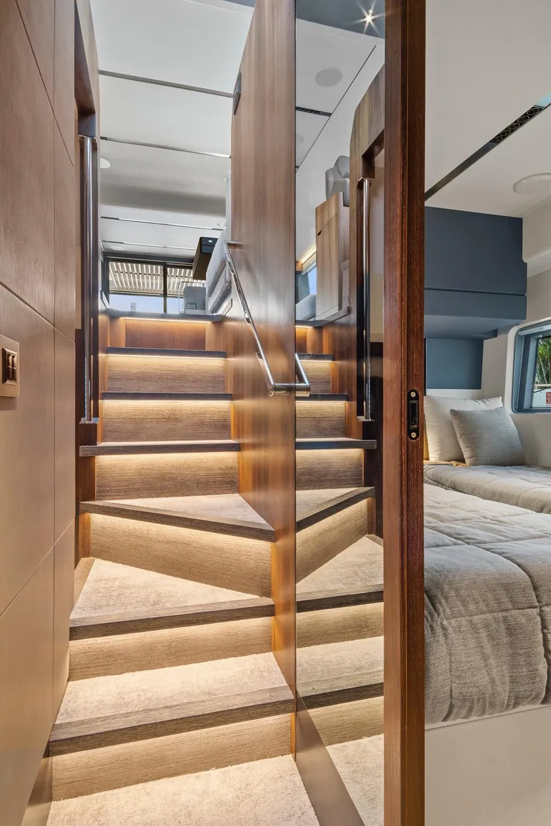 Slide: The Image of Luxurious interior of 2023 Astondoa AS5 yacht with elegant wooden staircase and modern bedroom. - 32
