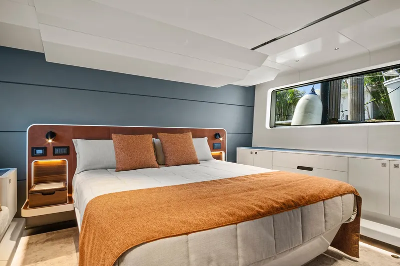 Slide: The Image of Luxurious 2023 Astondoa AS5 yacht bedroom with modern design and large window. - 34