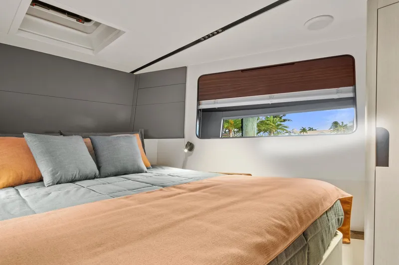 Slide: The Image of Luxurious bedroom interior of 2023 Astondoa AS5 yacht with modern design and large window view. - 36