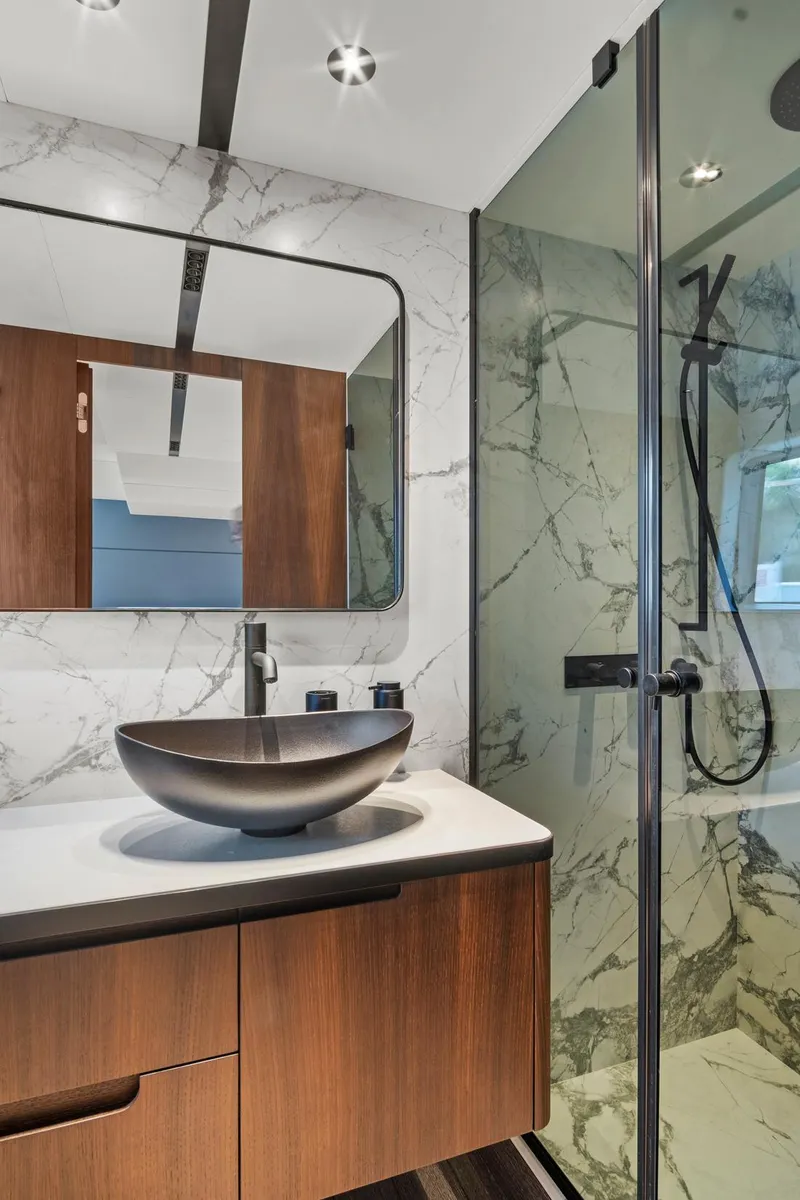 Slide: The Image of Luxurious bathroom in 2023 Astondoa AS5 yacht with modern fixtures and marble accents. - 39