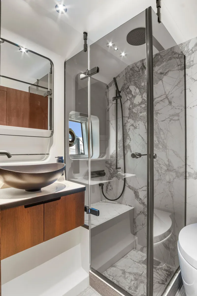 Slide: The Image of Luxurious bathroom in 2023 Astondoa AS5 yacht with modern fixtures and marble shower. - 43