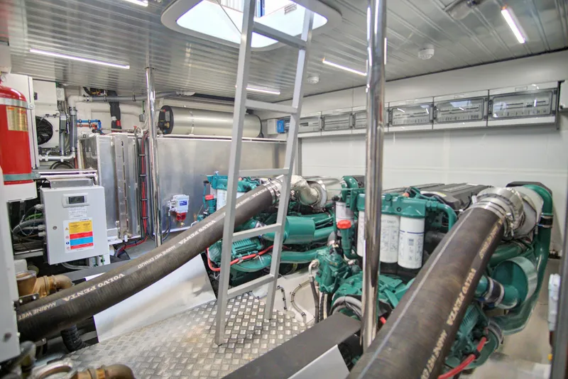 Slide: The Image of Engine room of 2023 Astondoa AS5 yacht with modern equipment and ladder. - 46