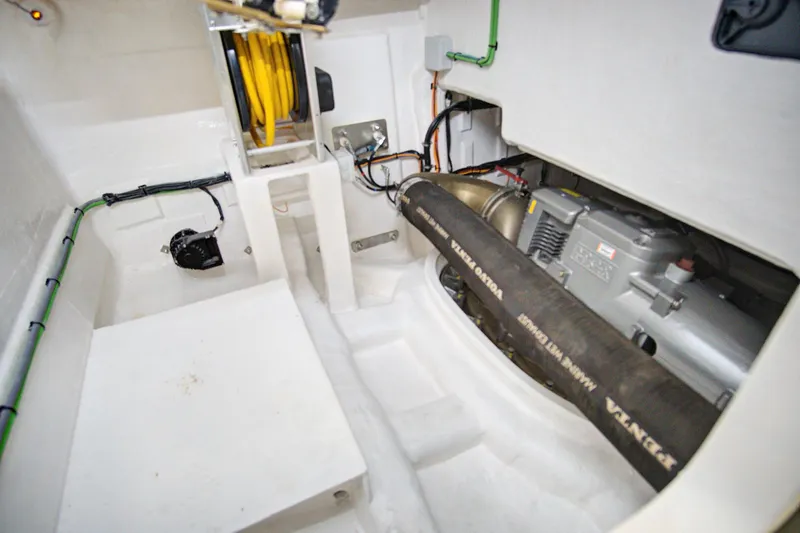 Slide: The Image of Engine compartment of 2023 Astondoa AS5 yacht, showcasing mechanical components and wiring. - 48