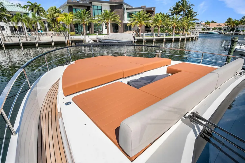 Slide: The Image of Luxury 2023 Astondoa AS5 yacht with spacious sun deck in marina setting. - 7