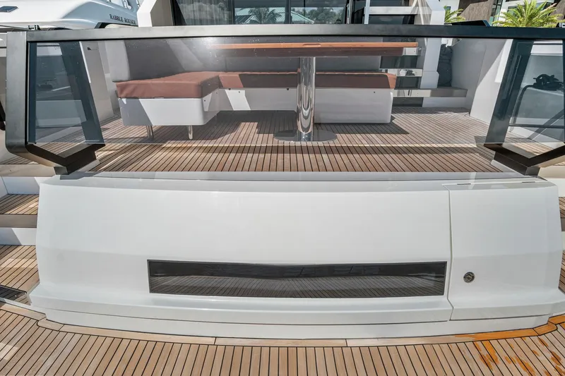 Slide: The Image of 2023 Astondoa AS5 yacht deck with modern seating and sleek design. - 9