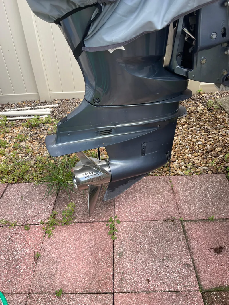 Slide: The Image of 2007 Pro-Line 25 Sport outboard motor on a paved surface. - 16