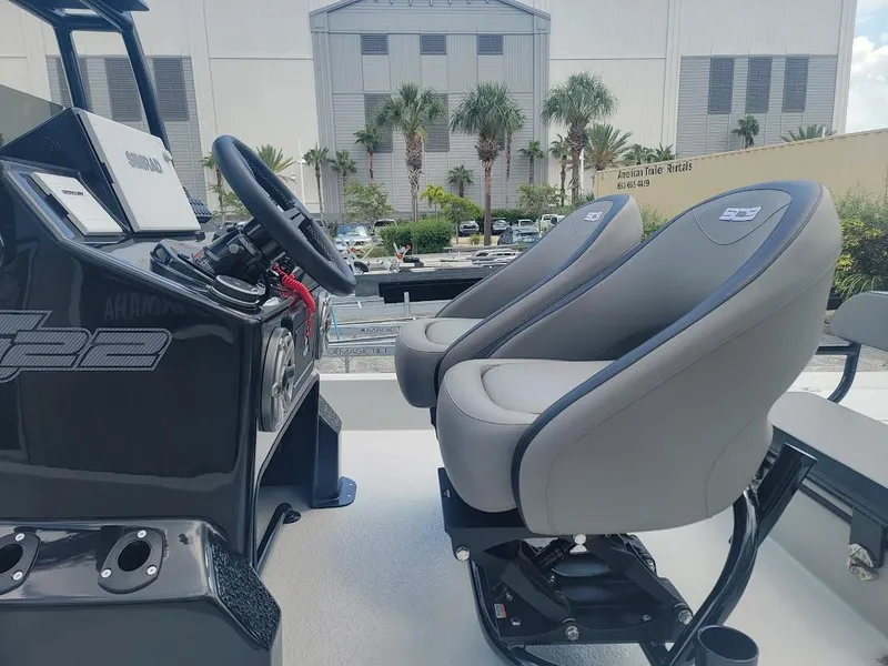 Slide: The Image of 2025 SCB S22 boat interior with dual gray seats and steering console. - 10