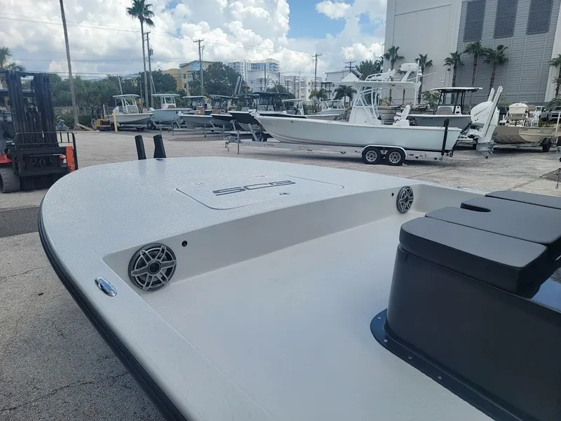 Slide: The Image of 2025 SCB S22 boat at marina, featuring sleek design and modern amenities. - 12