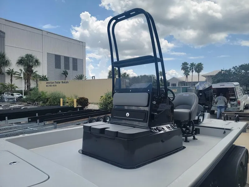 Slide: The Image of 2025 SCB S22 boat with sleek console design, parked outdoors under a cloudy sky. - 14