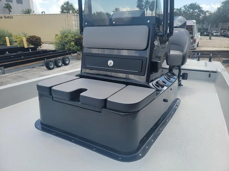 Slide: The Image of 2025 SCB S22 boat console with cushioned seating and storage compartments. - 15