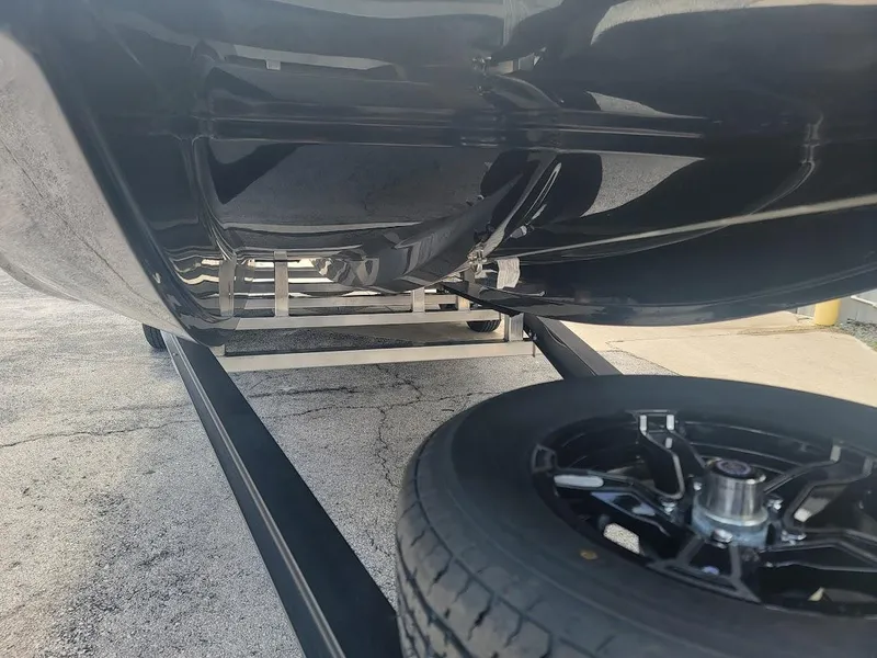 Slide: The Image of 2025 SCB S22 undercarriage view with black wheel on trailer. - 18