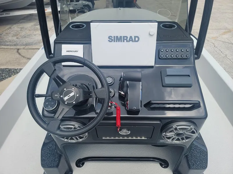 Slide: The Image of SCB S22 2025 boat console with Simrad display and steering wheel. - 21