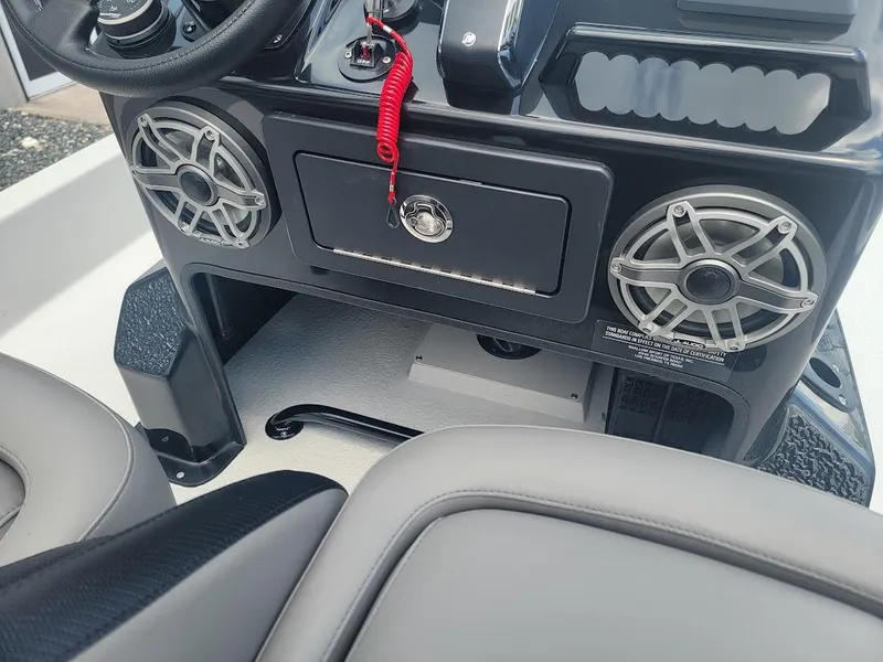 Slide: The Image of 2025 SCB S22 boat dashboard with speakers and control panel. - 22