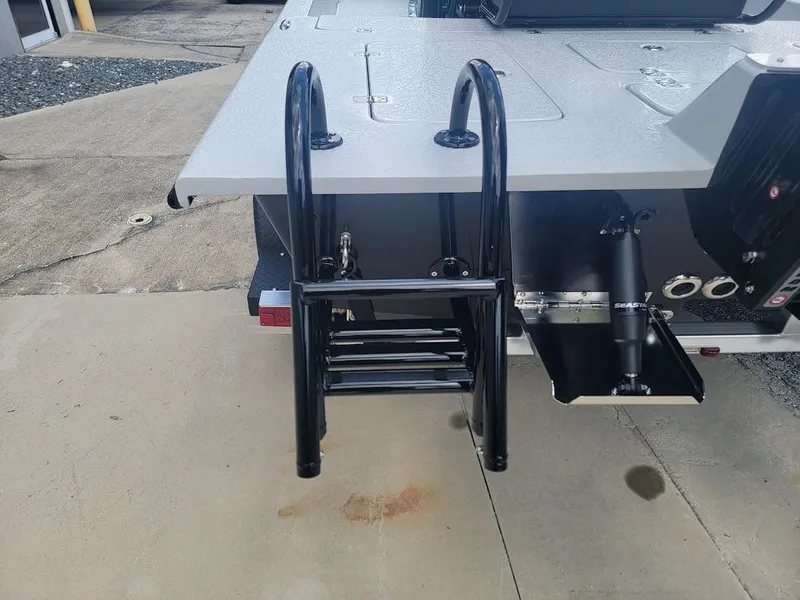 Slide: The Image of SCB S22 2025 model boat with a foldable ladder on the rear deck. - 7