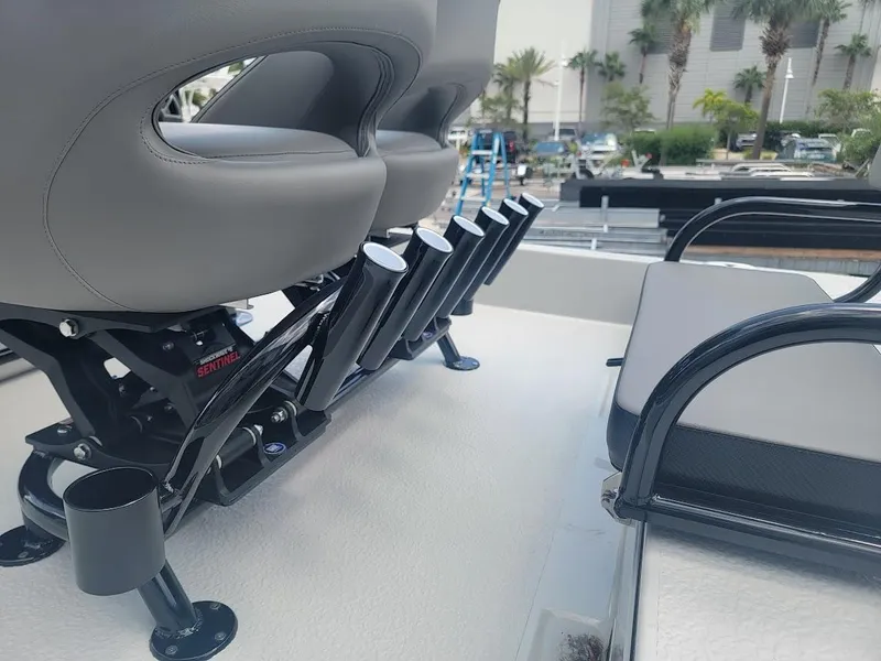 Slide: The Image of 2025 SCB S22 boat seating with rod holders and sleek design. - 9