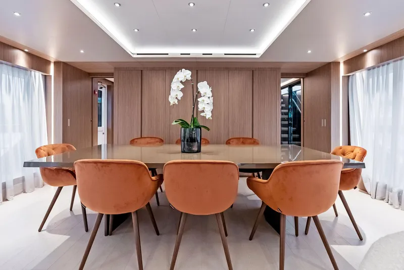 Slide: The Image of Luxurious dining area on 2023 Custom Line 106' yacht with elegant decor and seating. - 11