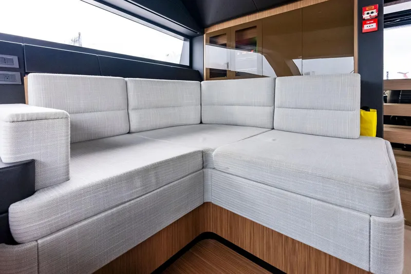 Slide: The Image of Luxurious interior of 2023 Custom Line 106' yacht with modern gray seating. - 13