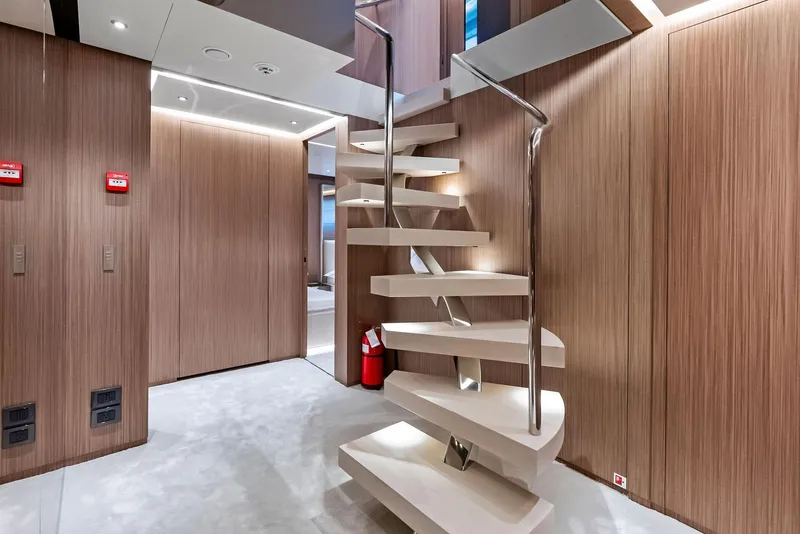 Slide: The Image of Modern yacht interior with sleek spiral staircase, Custom Line 106', 2023 model. - 19