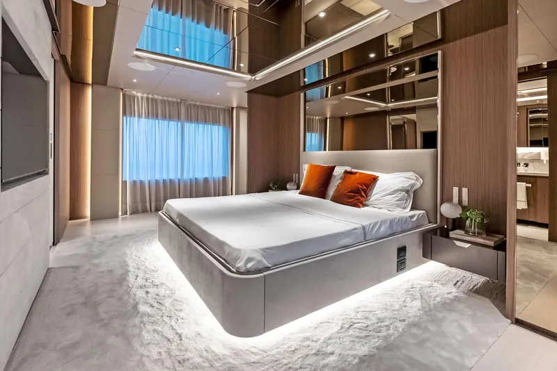 Slide: The Image of Luxurious 2023 Custom Line 106' yacht bedroom with modern design and ambient lighting. - 27