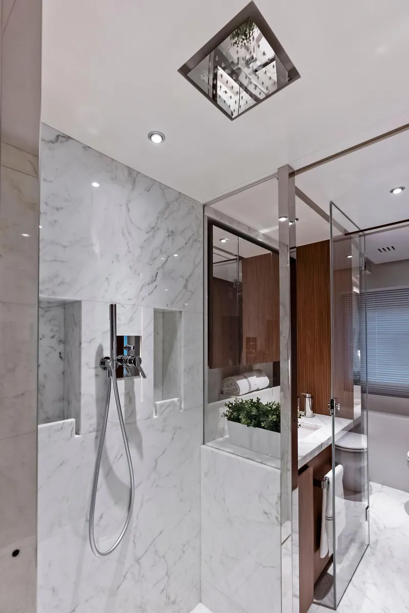 Slide: The Image of Luxurious yacht bathroom with marble shower, modern fixtures, and elegant design, 2023 Custom Line 106'. - 32
