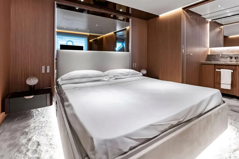 Slide: The Image of Luxurious bedroom interior on 2023 Custom Line 106' yacht, featuring modern design and elegant wood finishes. - 33