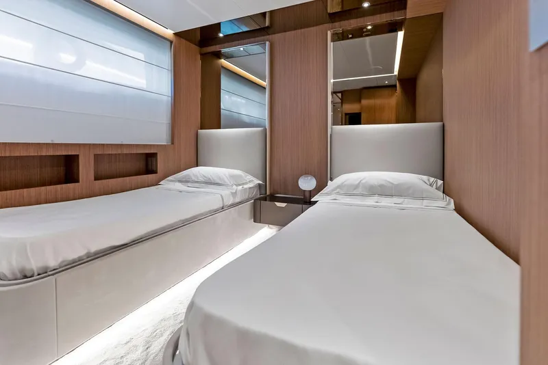 Slide: The Image of Luxurious twin bedroom in 2023 Custom Line 106' yacht, featuring modern design and elegant finishes. - 40