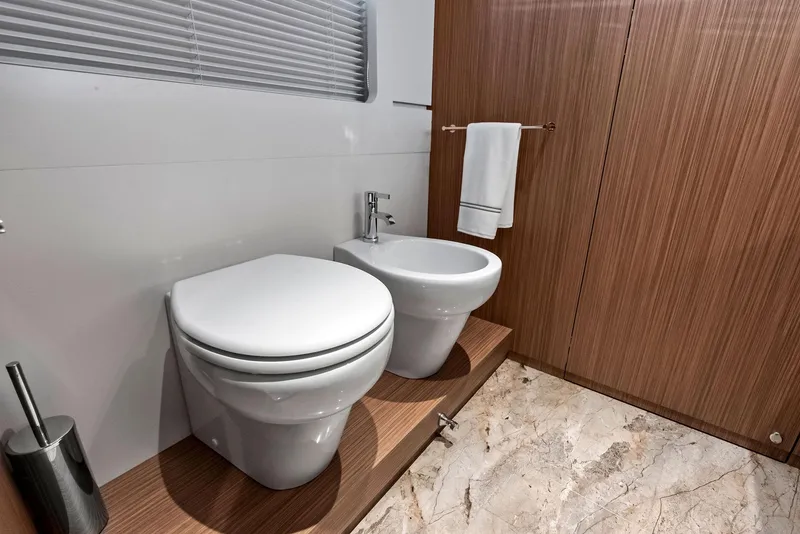 Slide: The Image of Luxurious bathroom in 2023 Custom Line 106' yacht with modern fixtures and marble flooring. - 45
