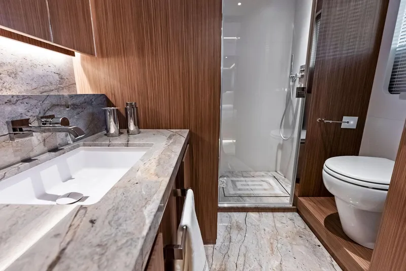Slide: The Image of Luxurious 2023 Custom Line 106' yacht bathroom with marble countertops and modern fixtures. - 46