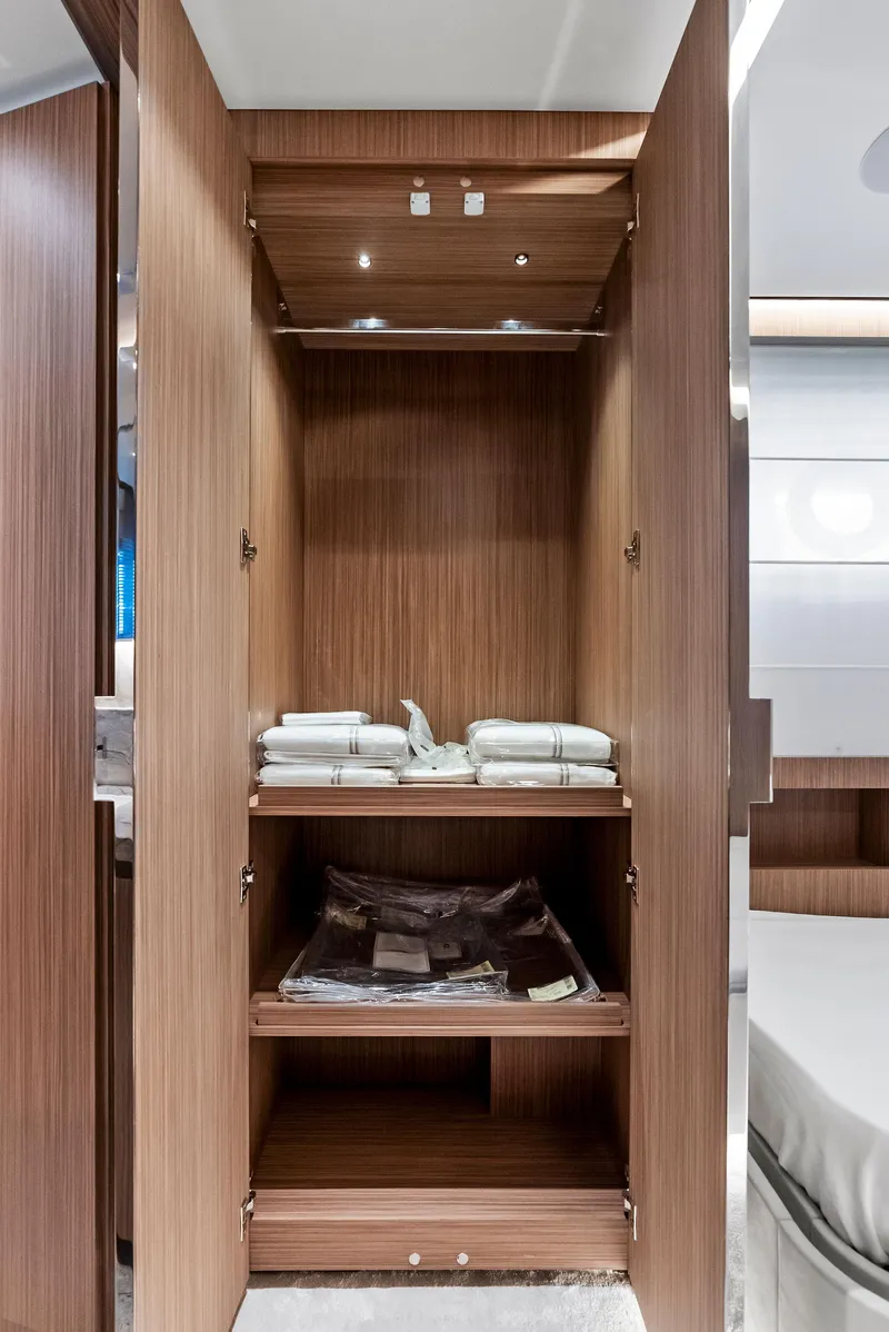 Slide: The Image of Luxurious wooden wardrobe interior on 2023 Custom Line 106' yacht. - 47