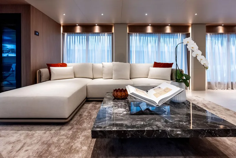 Slide: The Image of Luxurious yacht interior with modern sofa, marble table, and elegant decor, 2023 Custom Line 106'. - 6