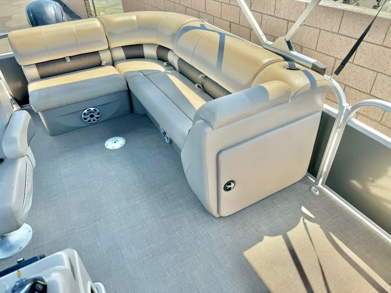 Slide: The Image of 2023 Sun Tracker Party Barge 20 DLX interior with plush seating and modern design. - 14