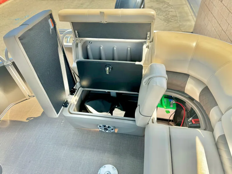 Slide: The Image of 2023 Sun Tracker Party Barge 20 DLX interior with open storage compartment. - 21