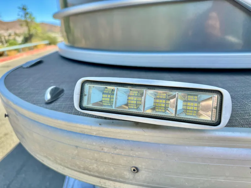 Slide: The Image of 2023 Sun Tracker Party Barge 20 DLX LED light detail on deck. - 9