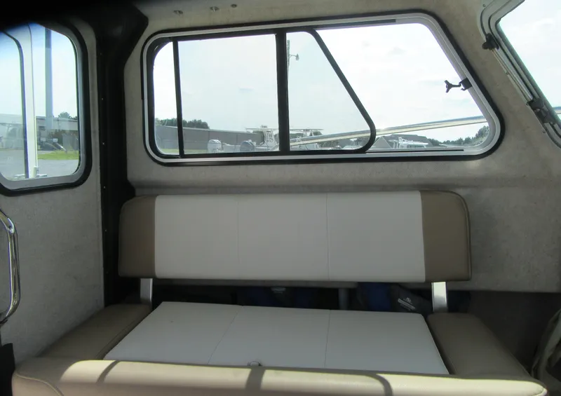 Slide: The Image of Interior of 2018 Parker 2320 SL Sport Cabin with seating and windows. - 16