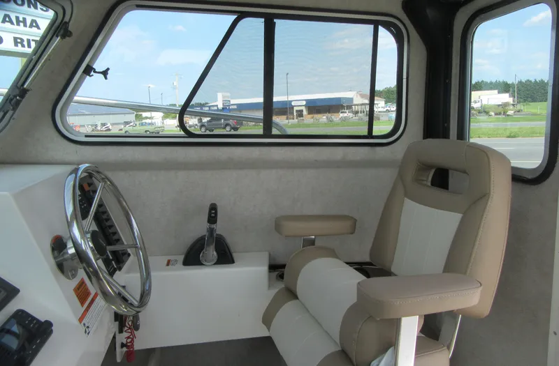 Slide: The Image of Interior of 2018 Parker 2320 SL Sport Cabin with steering wheel and seat. - 18