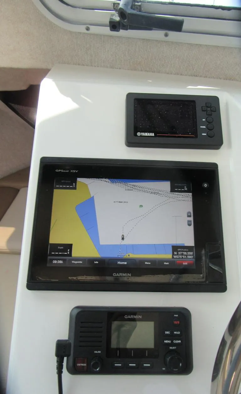 Slide: The Image of 2018 Parker 2320 SL Sport Cabin dashboard with Garmin navigation system. - 21