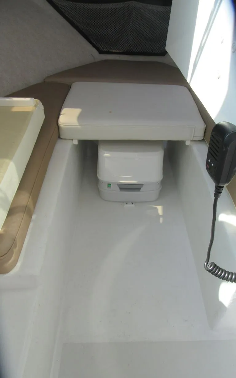 Slide: The Image of 2018 Parker 2320 SL Sport Cabin interior with compact toilet and seating. - 24