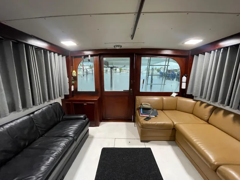 Slide: The Image of Interior of 1986 Post 43 Sport Fisher with leather seating and wood accents. - 10