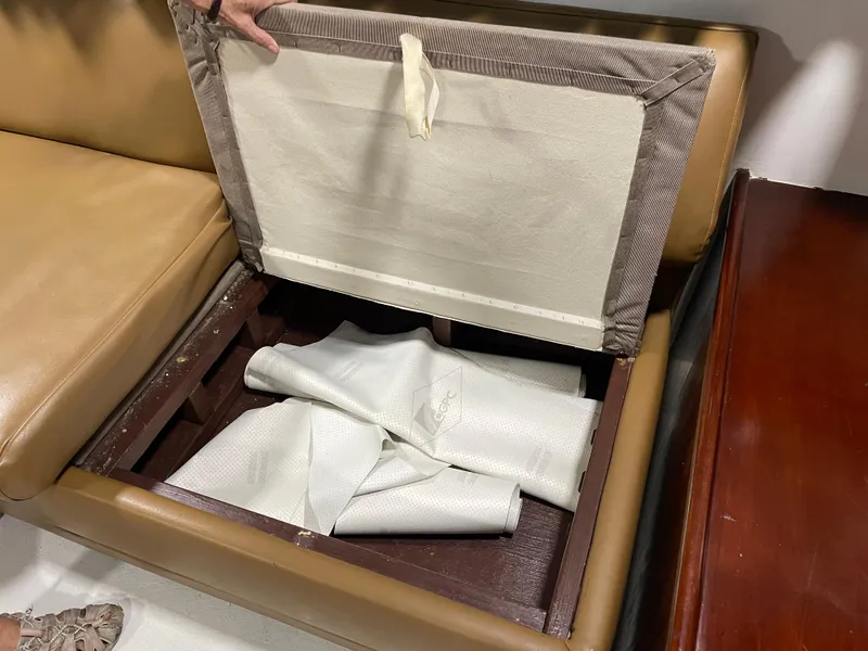 Slide: The Image of Open storage compartment in 1986 Post 43 Sport Fisher boat with fabric inside. - 12
