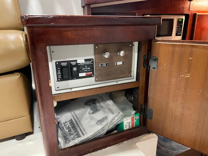 Slide: The Image of 1986 Post 43 Sport Fisher electrical panel inside wooden cabinet. - 14