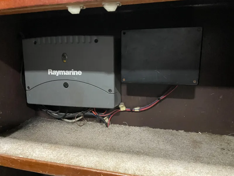 Slide: The Image of Raymarine equipment inside a 1986 Post 43 Sport Fisher boat compartment. - 21