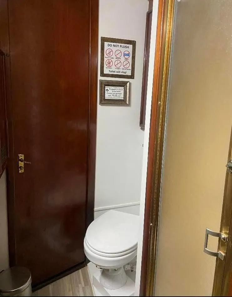 Slide: The Image of 1986 Post 43 Sport Fisher bathroom with wooden door and shower. - 41